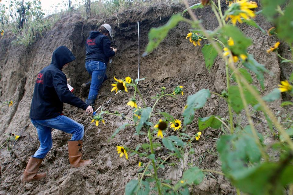 Students climb the wall to retrieve soil samples during class Sept. 7, 2018, at a former mine south of Lincoln. | Shawna Richter-Ryerson, natural resources