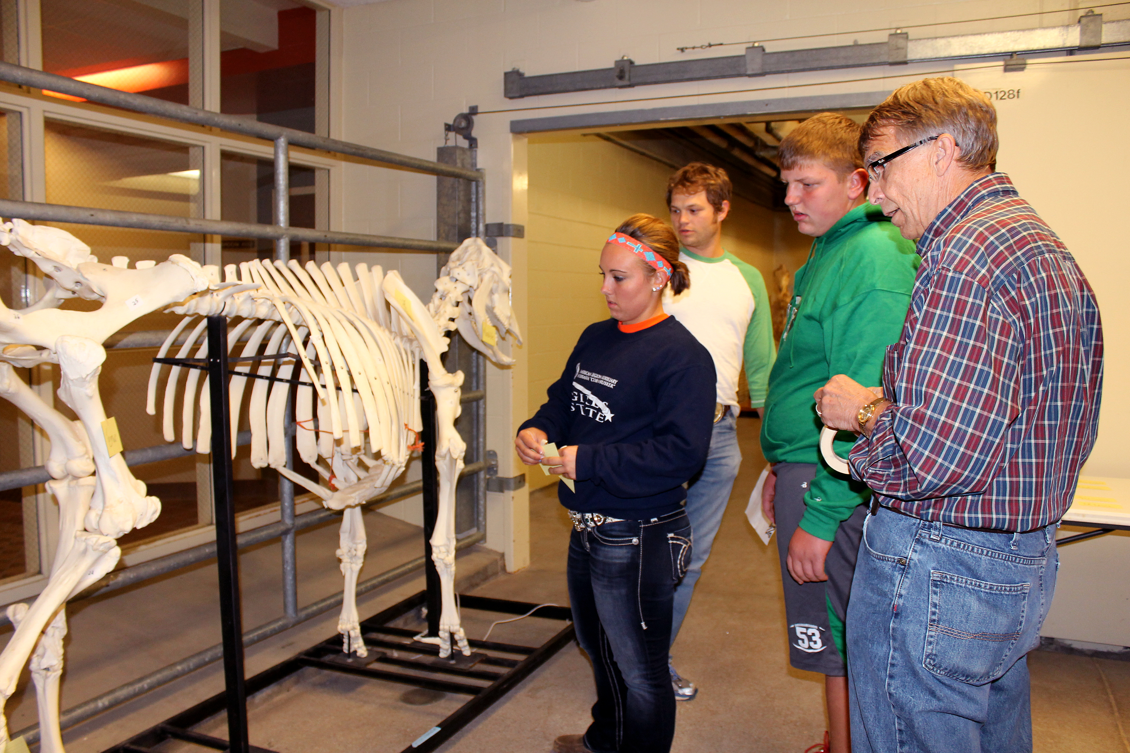 Department of Animal Science Professor Dennis Brink (right) interacts with some students from various schools at our annual an annual Open House at the University of Nebraska-Lincoln animal science complex.