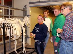 Department of Animal Science Professor Dennis Brink (right) interacts with some students from various schools at our annual an annual Open House at the University of Nebraska-Lincoln animal science complex. Students get some hands-on experience with equin
