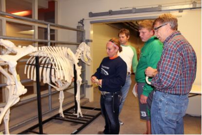  Department of Animal Science Professor Dennis Brink (right) interacts with some students from various schools at our annual an annual Open House at the University of Nebraska-Lincoln animal science complex.