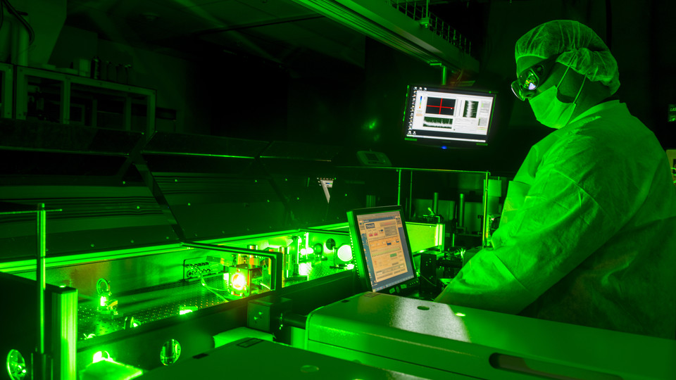 A technician aligns a laser at the Extreme Light Laboratory. The university is one of nine founding members of the LaserNetUS network.