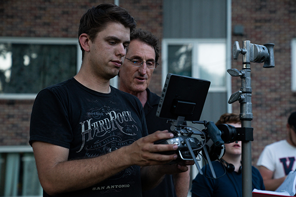 Director Seth Pinsker (right) reviews footage with Ben Hartzell (B.F.A. 2017) during filming last May. Photo by Jordan Opp.