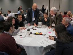 Fadi Alsaleem (standing left), assistant professor of architectural engineering, and Jay Puckett, director of The Durham School of Architectural Engineering and Construction, lead a discussion during the afternoon session Nov. 9 at the Smart Building and 