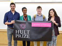 After being chosen to represent Nebraska at a regional contest in Boston, winning team Uhusiano poses with Hult Prize director Gloria Mwiseneza. From left, Matthew Brugger, Mwiseneza, Eli Wolfe and Cheyenne Gerlach. Photo credit: College of Business