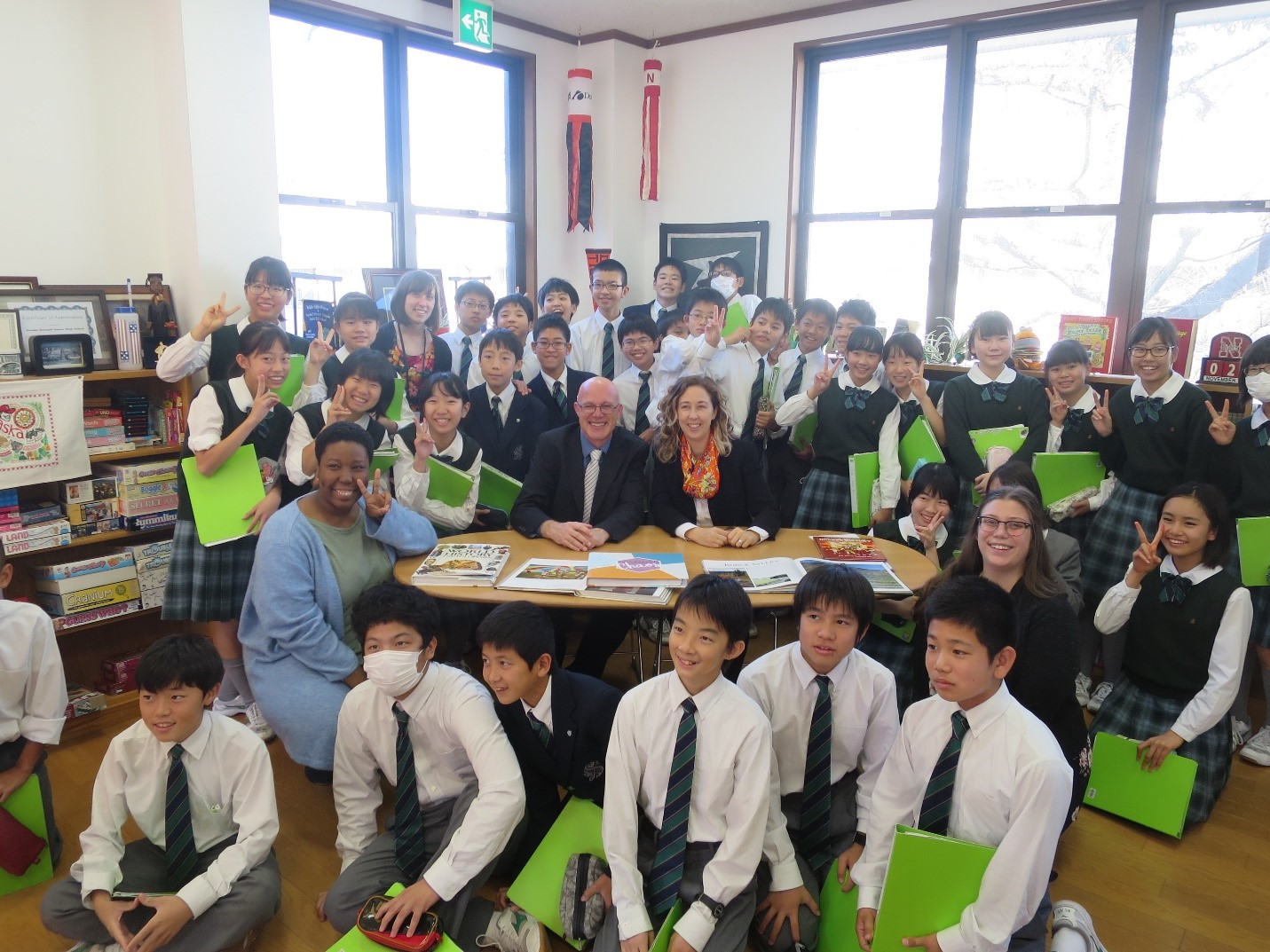 Chris Dunsmore and Maegan Stevens-Liska pose with Senshu University Matsudo Junior High School students and UNL interns, Danielle Young and Hope Anderson, during their visit in November 2018.