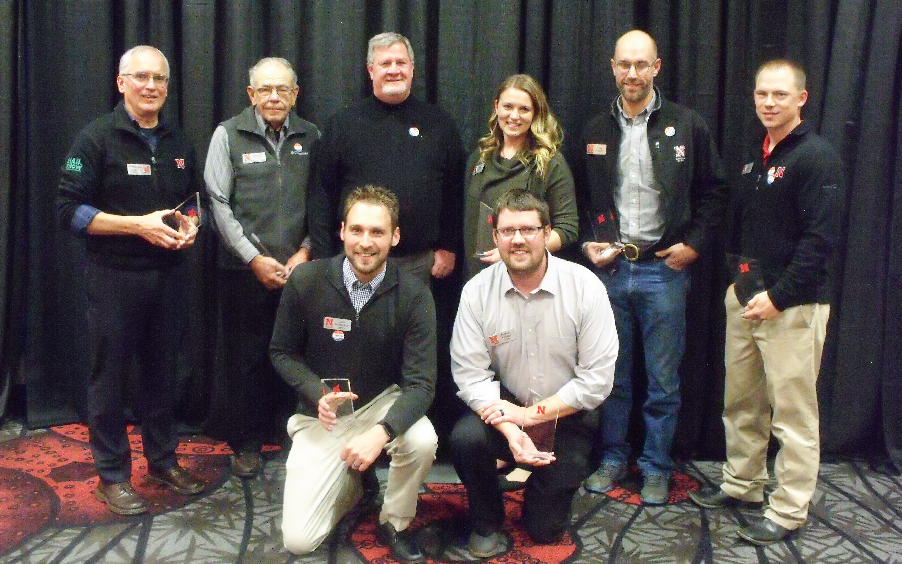 Hail Know team members Justin McMechan (front row, left to right), Nathan Mueller, Roger Elmore (back row, left to right), Robert Klein, Daren Redfern, Ashley Mueller, Chris Proctor and Tyler Williams receive the Excellence in Extension Team award.