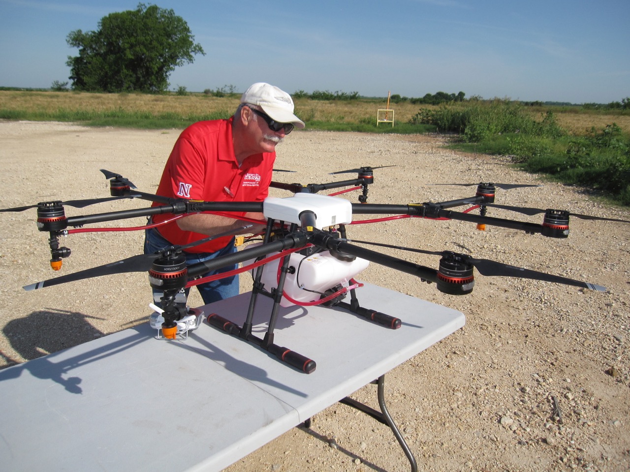 Dr. Wayne Woldt prepares a DJI MG-1 remotely piloted aerial application system for research flight.