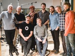 Paul Barnes (back row, left) with Brooklyn Rider, Liana Sandin (back row, third from left) and engineers from Octaven Audio during the recording of a new CD featuring the chamber music of Philip Glass. Courtesy photo.