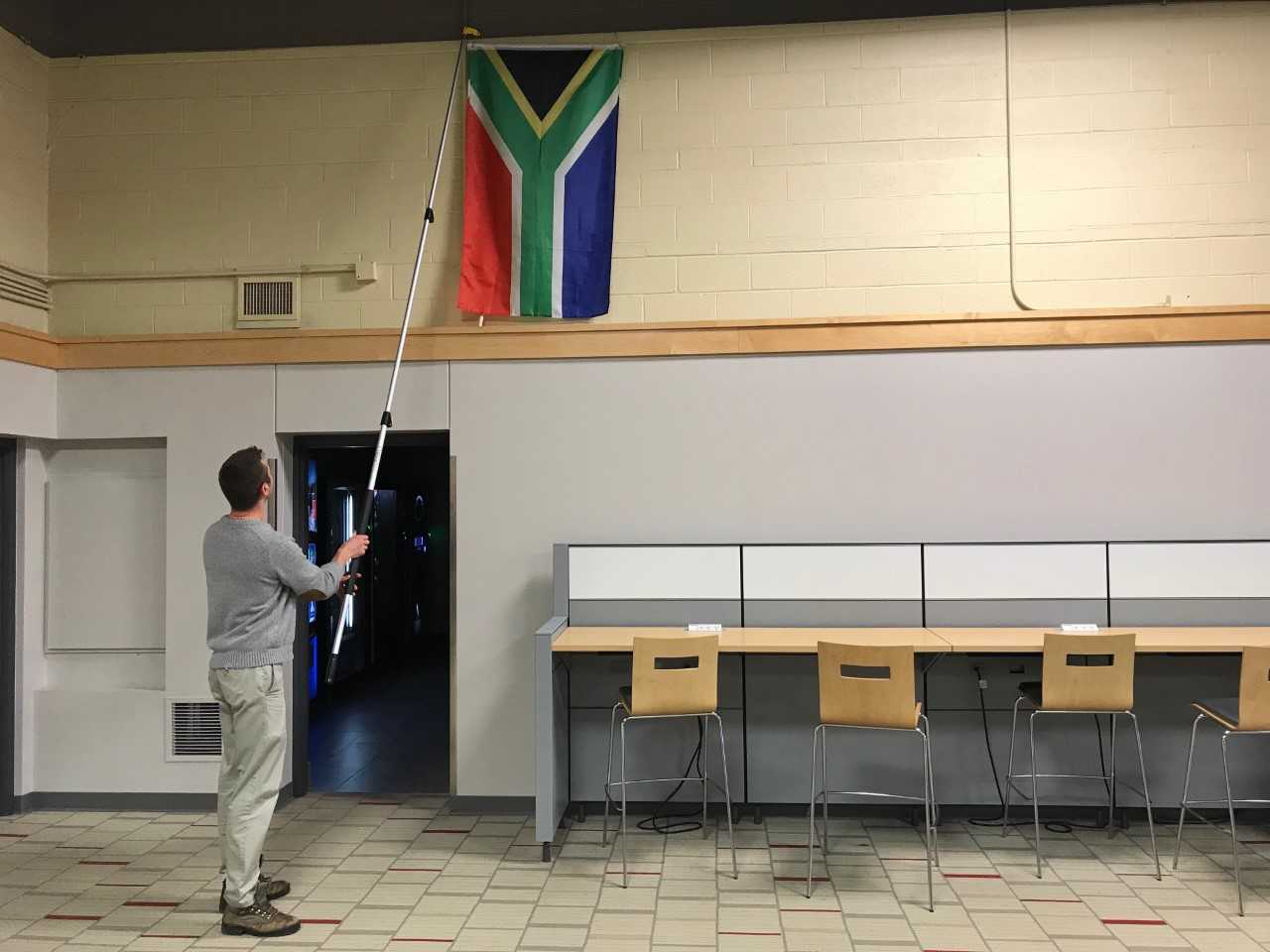 UNL Facilities helped find the right location to hang the flags, and gave them tools to hang the flags.