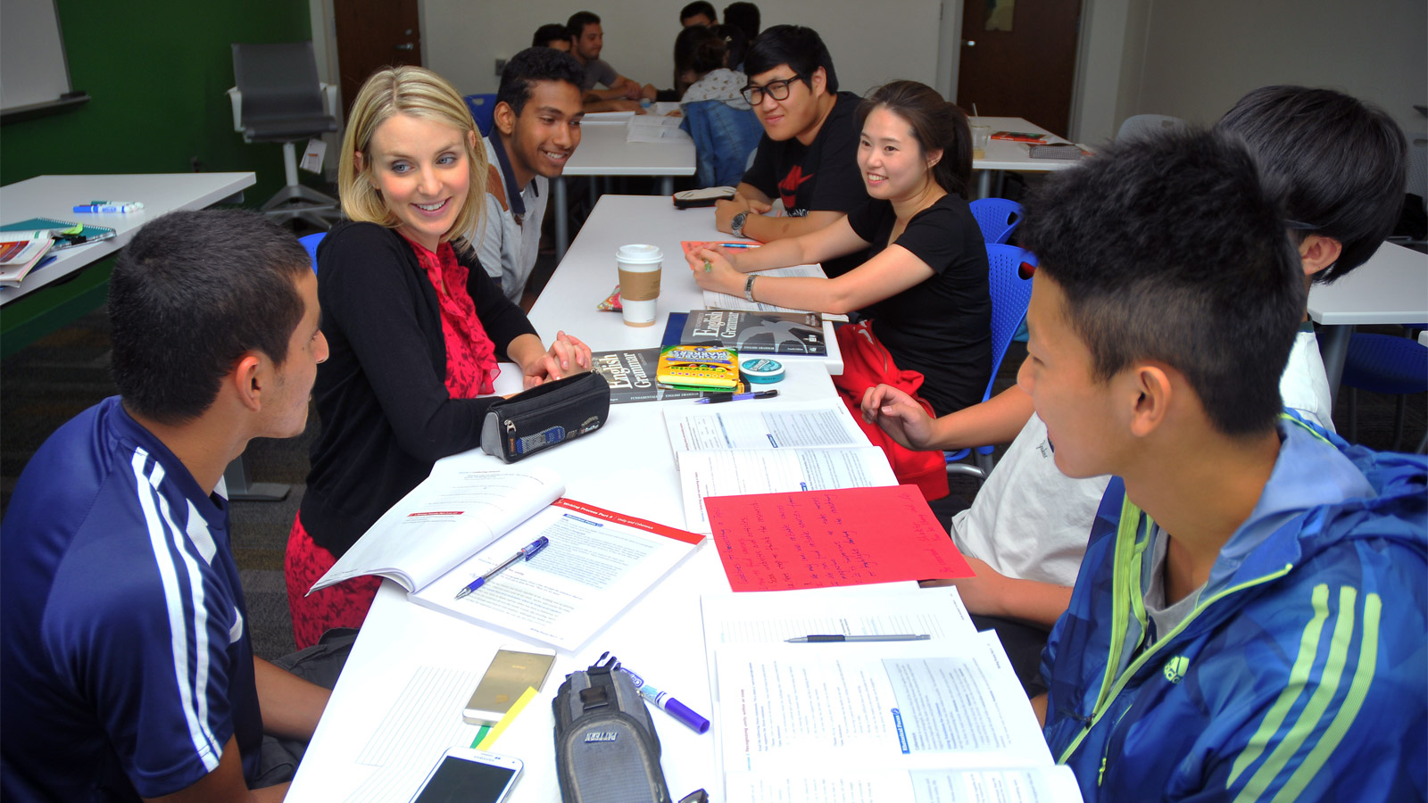 Students meet with a PIESL staff member to improve their English skills. Courtesy photo.