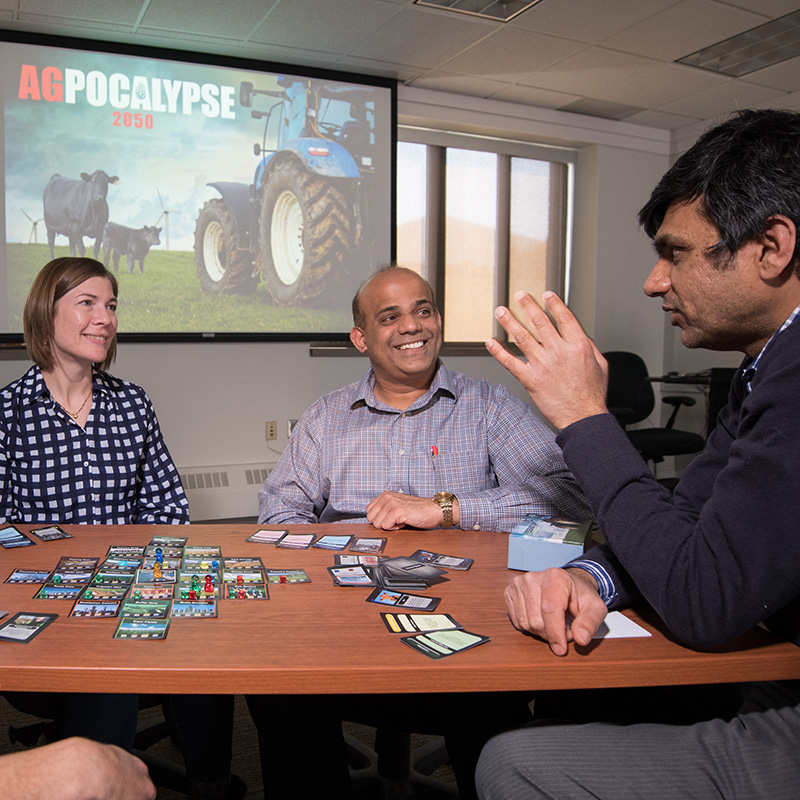 BSE faculty (from left) Jenny Keshwani, Jeyam Subbiah and Ashu Guru led a team that developed a video game that teaches real-world farming to middle and high school students.