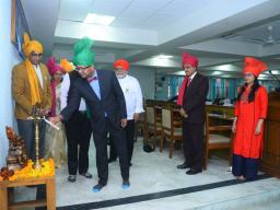 Dipra Jha lights a traditional lamp inaugurating an international seminar on food, hospitality and tourism at Maharshi Dayanand University in Rohtak, India.