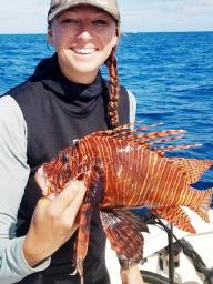 Brown with an invasive lionfish