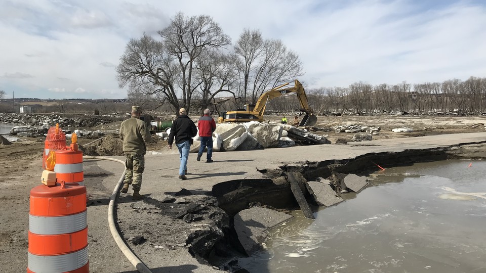 Nebraska officials assess road damage caused by recent flooding. | Courtesy Courtesy Nebraska Emergency Management Agency 