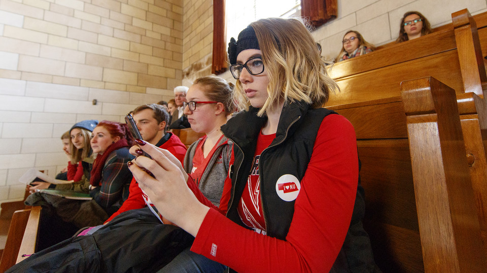  Husker Tia Rasmussen takes a photo of the legislative session while attending the "I Love NU" Advocacy Day at the State Capitol in 2018. The event was attended by several hundred students, staff, faculty, alumni and friends of the NU system. | Craig Chan