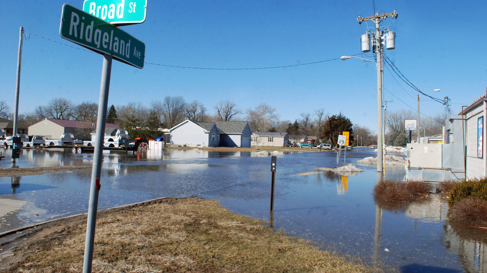 (Photo by Tammy Real-McKeighan, Fremont Tribune) Floodwaters fill an intersection in Fremont earlier this month. Student journalists from the College of Journalism and Mass Communications will travel this weekend to report on the flood response in Fremont