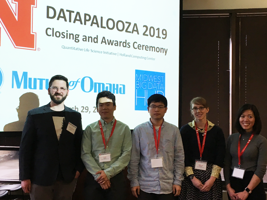 The interdisciplinary team DataSaber with members Qian Du, Yu Shi, computer science major Molly Lee, and Thao Vu at the Datapalooza competition.