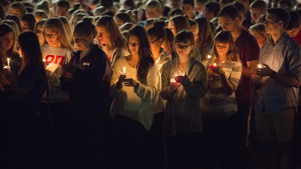  Students participate in a candlelight vigil honoring Keaton Klein and Clayton Real in 2014. The university will honor students, faculty, staff and alumni who died during the current academic year in 2015. | University Communication file photo.