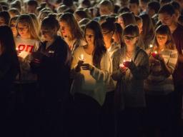  Students participate in a candlelight vigil honoring Keaton Klein and Clayton Real in 2014. The university will honor students, faculty, staff and alumni who died during the current academic year in 2015. | University Communication file photo. |