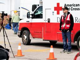 Journalism student Kenneth Ferriera interviews Red Cross Disaster Services volunteer Joel Olavarrio outside a shelter in Fremont. Students from the College of Journalism and Mass Communications are recording stories from the communities impacted by recent