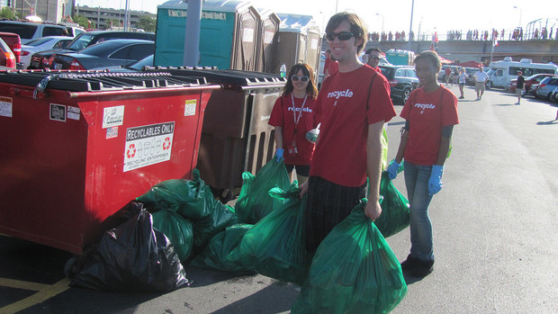  Go Green for Big Red Volunteers collect recycling bags during a Husker football game. The recycling initiative is among successes for the university's sustainability programs. | Univer
