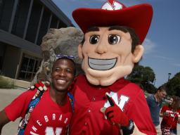 Student with Herbie Husker