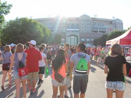 Students walk the Memorial Stadium Loop at the Big Red Welcome Street Festival.