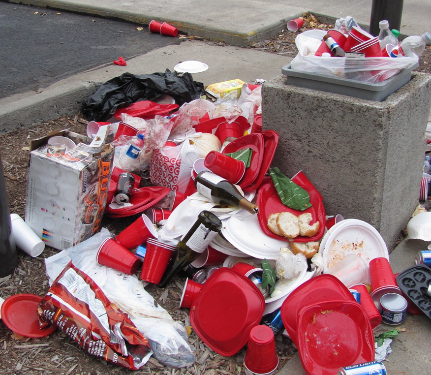 Tailgaters can help UNL volunteers collect recyclables at Stadium lots to avoid messes like this from last year.