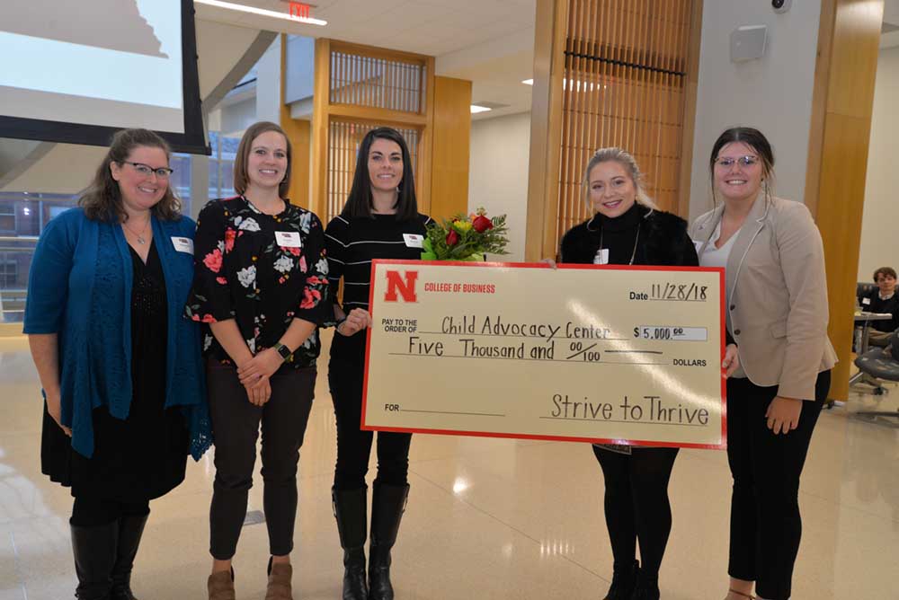 Michelle Zinke, Laura Opfer and Destiny Burkett accept a Fall '18 grant. 