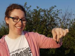 Alison Ludwig holds an American burying beetle. Courtesy Nebraska NRT Program