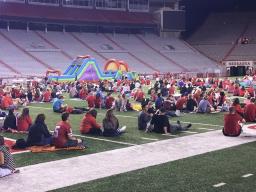 Families attend the football watch party inside Memorial Stadium.