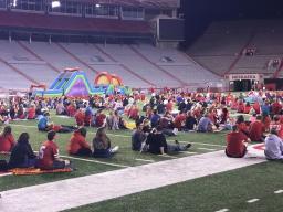 Families attend the football watch party inside Memorial Stadium.