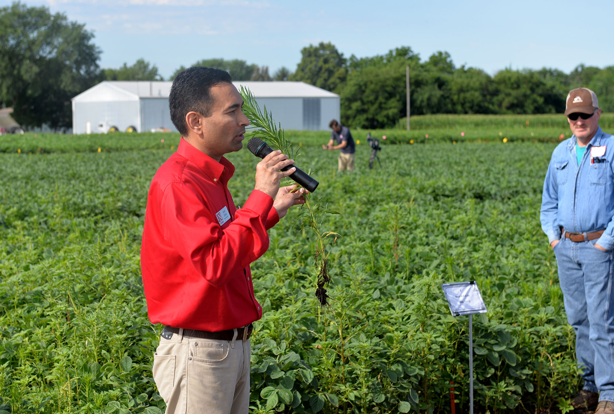   Amit Jhala, associate professor and Nebraska Extension weed management specialist, discusses a project for control of glyphosate-resistant marestail and Palmer amaranth in soybean during a field day July 10 near Carleton, Nebraska.