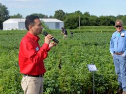   Amit Jhala, associate professor of agronomy and horticulture and Nebraska Extension weed management specialist, discusses a project for control of glyphosate-resistant marestail and Palmer amaranth in soybean during a field day July 10 near Carleton, Ne