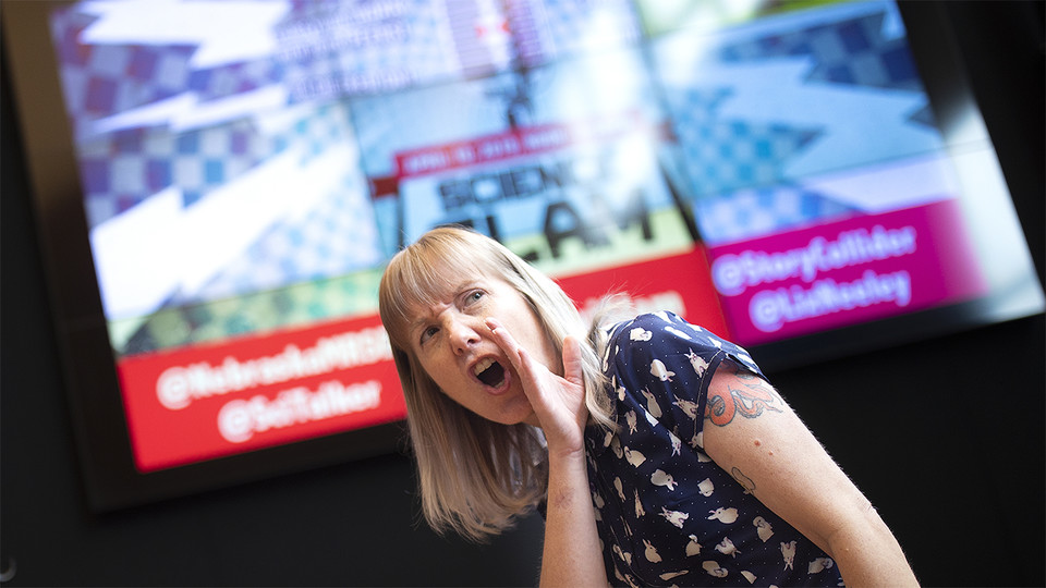 Alice MillerMacPhee, graduate student in sociology, performs April 10 at the Wick Alumni Center. An audience of about 100 voted MillerMacPhee the winner of Nebraska's fourth annual Science Slam.