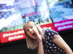 Alice MillerMacPhee, graduate student in sociology, performs April 10 at the Wick Alumni Center. An audience of about 100 voted MillerMacPhee the winner of Nebraska's fourth annual Science Slam.