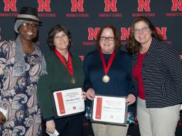 Lory Dance, Christina Falci, graduate student Jennifer Andersen, and Julia McQuillan celebrate awards won by Falci and Andersen at a ceremony earlier this year. 