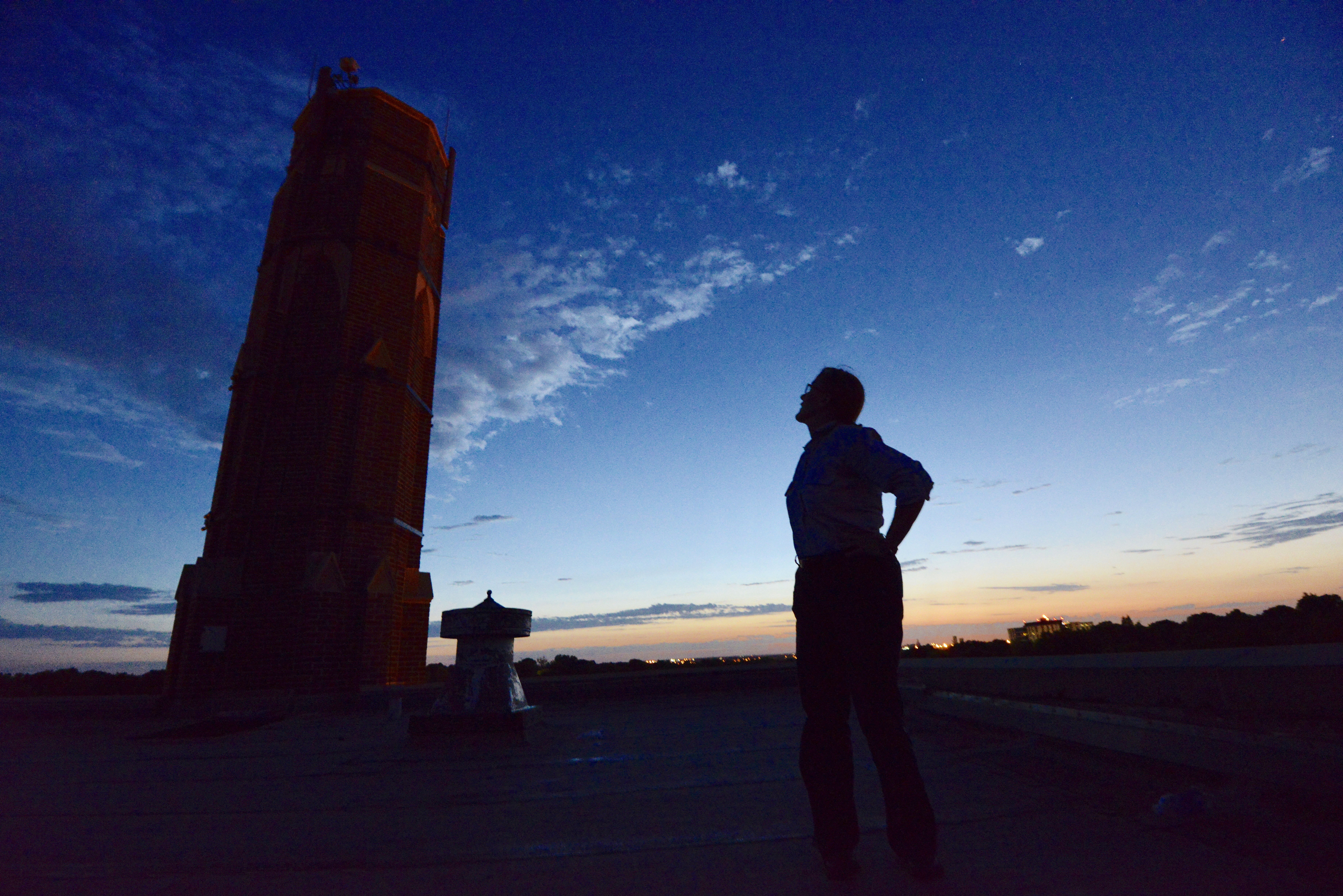 Mary Bomberger Brown at the Irving Middle School chimney where chimney swifts roost. | Image courtesy Michael Forsberg