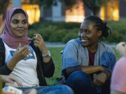 Julienne Irihose (right) reacts to Sara Alhuraizi (left) at the International Club meeting on the green space in front of the Union on University of Nebraska-Lincoln's city campus on Wednesday, Sept. 12, 2019, in Lincoln, Nebraska. Photo credits: The Dail