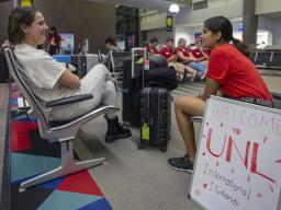 Shridula Hegde (right) talks with Katie Brooks during international student welcome activities on Aug. 19 at the Lincoln Airport. Though it meant a longer flight, Brooks landed in Lincoln to take advantage of Nebraska's enhanced welcome activities for stu