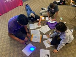 Students at CSE Hack Day participate in an Escape Room Challenge activity.