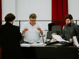 Tyler White (center) rehearses with Patrick McNally (left) and Matthew Gerhold. The Glenn Korff School of Music is premiering a new opera “The Gambler’s Son” by composer Tyler Goodrich White and librettist Laura White. The opera is adapted from Mari Sando