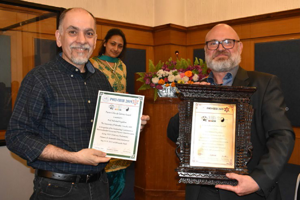 Mehrdad Negahban (left), professor of mechanical and materials engineering.