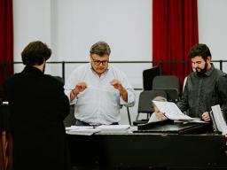 Tyler White (center) rehearses with Patrick McNally (left) and Matthew Gerhold. The Glenn Korff School of Music is premiering a new opera “The Gambler’s Son” by composer Tyler Goodrich White and librettist Laura White.