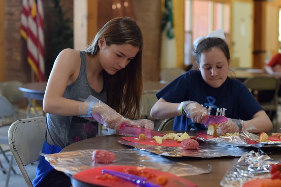 Youth cutting Nebraska potatoes for lunch at Kool Kravings camp. - Image courtesy of Nebraska State 4-H Camp