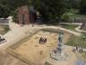The focus of this summer’s Jamestown Rediscovery archaeological research and field school at Jamestown was the comprehensive excavation of the 1608-1617  church (foreground behind John Smith statue). The work uncovered a rectangular pattern of  postholes 