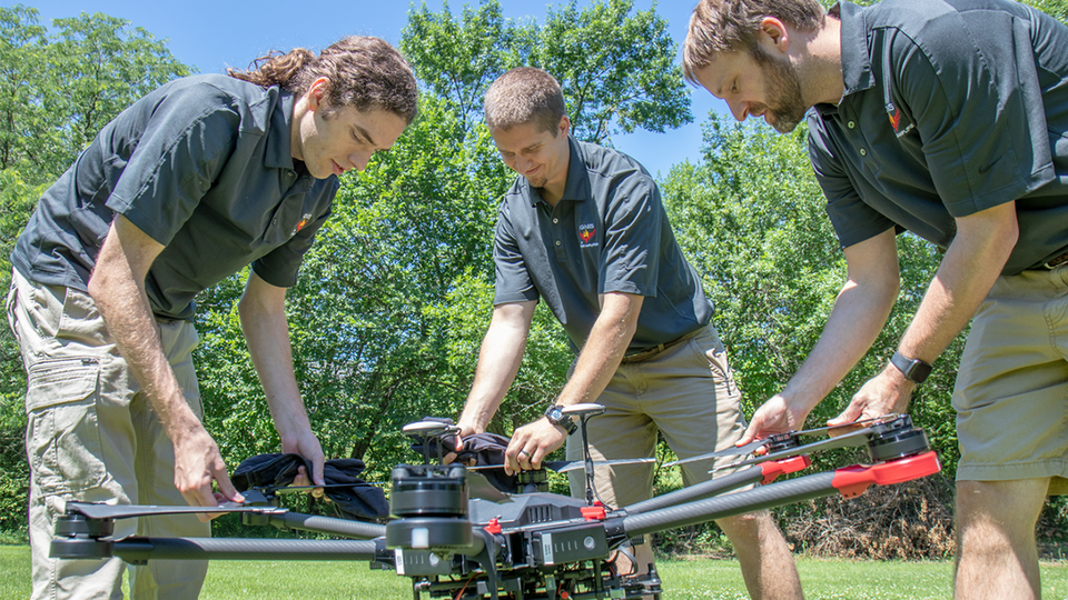 Evan Beachly (from left), Jim Higgins and Carrick Detweiler assemble a drone system before taking it for a test flight. The system features a software application that makes it easy to operate. It can also be flown at night, helping crews safely fight fir