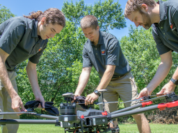 Evan Beachly (from left), Jim Higgins and Carrick Detweiler assemble a drone system before taking it for a test flight. The system features a software application that makes it easy to operate. It can also be flown at night, helping crews safely fight fir