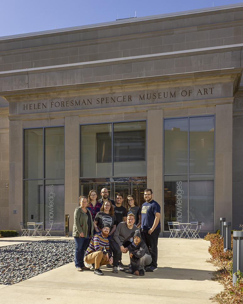 Assistant Professors Colleen Syron (back row, left) and Walker Pickering (back row, third from left) and eight students at the Spencer Museum of Art during the a2ru national conference. Courtesy photo.