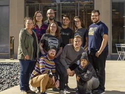 Assistant Professors Colleen Syron (back row, left) and Walker Pickering (back row, third from left) and eight students at the Spencer Museum of Art during the a2ru national conference. Courtesy photo.